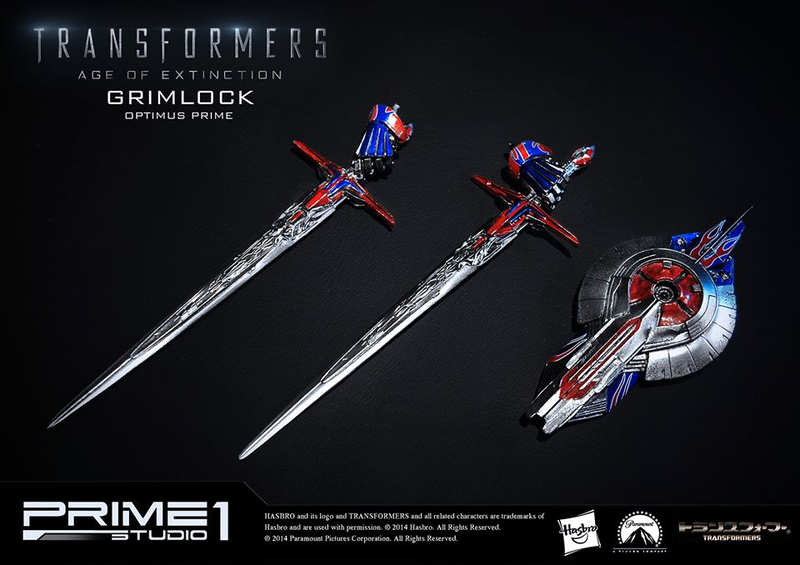 Illustration for article titled Glorious Grimlock and Optimus Prime Statue